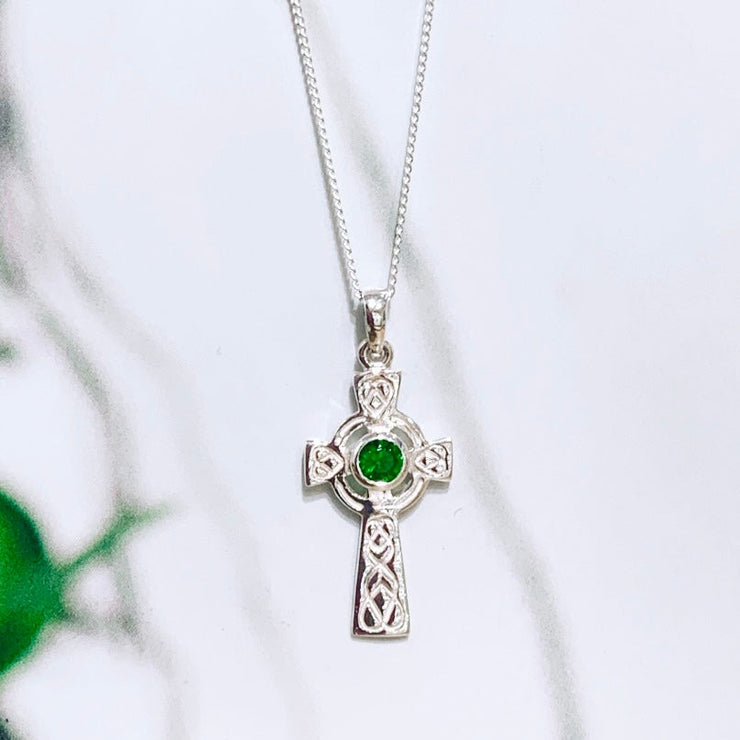 celtic cross with green stone